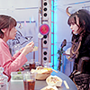 Kyoka holds food in front of Lachesis.